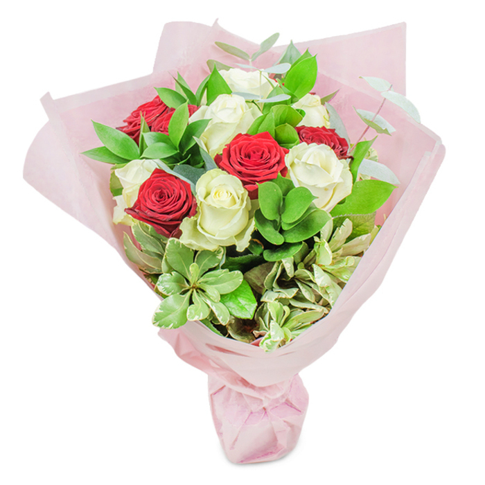 This exquisite bouquet, expertly arranged by Chessington Flowers, captures the romance and vitality that flow through Chessington's streets and green spaces. Approximately twenty radiant roses-with a balanced contrast of ten deep crimson and ten creamy white-form the heart of this lush display. Each rose is at its freshest, the petals perfectly furled, and their fragrant presence fills the space with an air of anticipation. Interspersed throughout are generous sprigs of glossy, dark green ruscus, lighter greens that offer textural variation, and delicate eucalyptus that lend the arrangement a sense of lightness and contemporary style. Subtle variegated leaves with cream highlights add depth and a unique, organic rhythm to the design. The hand-tied bouquet is wrapped in layers of soft, pastel pink floral paper, gathered elegantly at the base to create a dreamy, romantic effect. Light dances across the translucent wrapping, inviting the viewer to imagine the soft touch and gentle rustle as the bouquet is unwrapped. Whether sent as an anniversary surprise in Hook, a congratulatory gesture for a neighbour on Bridge Road, or a simple declaration of love, this bouquet is steeped in local character and expertise. The interplay of colours and fragrances is evocative of Chessington's garden charm, while the expert craftsmanship speaks to the high standards upheld by local florists. It is an ideal choice for those who wish to express affection or appreciation in a truly memorable way.