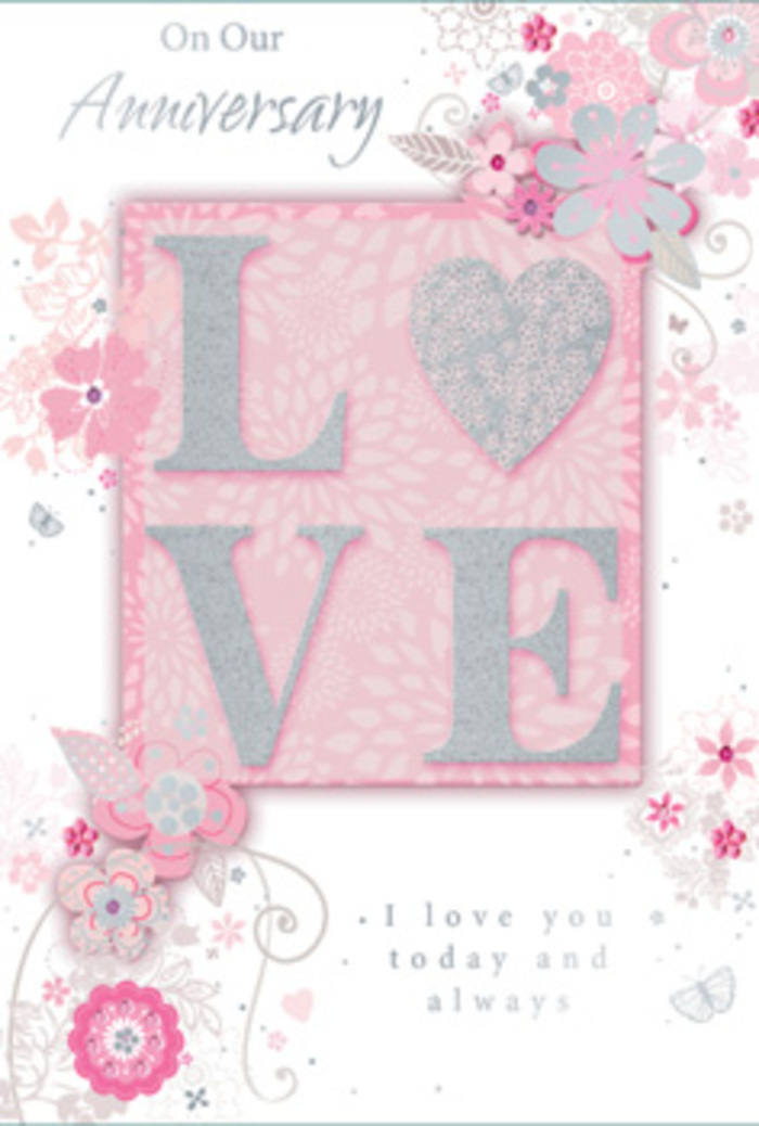 The anniversary card in this image feels like a hand-tied bouquet translated into paper, with all the tenderness of a delivery arriving at a Chessington doorstep on a special evening. At its heart, the word LOVE stands prominently in raised, glitter-trimmed letters, each one thick enough to cast the softest of shadows. The letters are rendered in a blend of blush pinks and creamy whites, kissed with pale silver along their edges so they shimmer without overwhelming the eye. This tactile effect invites fingertips to travel across the word, much as someone might trace the curve of a petal or ribbon on a romantic floral arrangement. The background is a generous field of soft pink, gently mottled to resemble a delicate wash of watercolour, giving the impression of warm, diffused light. Surrounding the central lettering, an intricate pattern of stylised flowers and trailing leaves unfurls gracefully, as if sketched by an experienced florist designing an anniversary centrepiece. The blooms are small and dainty, outlined in fine grey and silver lines, their petals shaded in blush and pearlescent tones that recall sweet pea, hydrangea, or late-spring roses. Slim, swirling vines connect each blossom and leaf, framing the composition without feeling heavy. In carefully spaced sections, elegant, flowing script is printed in an understated ink, expressing sentiments of love, commitment, and cherished memories. Together, the raised LOVE, the dreamy pink palette, and the floral scrollwork evoke the feeling of a romantic anniversary card gifted alongside fresh flowers from a local Chessington florist, intimate and artfully composed.