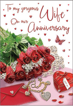 This anniversary card design unfolds like a private love letter set on a cosy tabletop in Chessington, where daylight falls gently across each carefully chosen element. A posy of crimson red roses, their swirling petals rich and almost touchable, anchors the scene with a sense of heartfelt devotion. The blooms feel as though they could have been freshly selected from the display at Chessington Flowers, each head perfectly open, ringed with glossy greenery that adds texture and life. Nearby rests an inviting envelope, slightly lifted at the corner, hinting at an affectionate message tucked inside. A small heart-shaped jewellery box in vivid red, secured with a neat ribbon, sits close to a slender golden necklace formed into intertwined hearts, echoing the unity of a long-term partnership. Tiny decorative hearts and sparkling details are scattered like stardust across the card's romantic backdrop, catching the light in a way that suggests candlelit celebrations at home. The scripted text flows gracefully across the card, its curves soft and welcoming, drawing the eye toward the centre where words of love and appreciation would appear. The lighting remains warm and flattering, softening every edge and shadow so that the composition feels intimate and reassuring, like a cherished tradition repeated each anniversary. Altogether, the design evokes the feeling of shared memories along Chessington's familiar streets, making it an ideal companion to an anniversary bouquet delivered to a loved one nearby.
